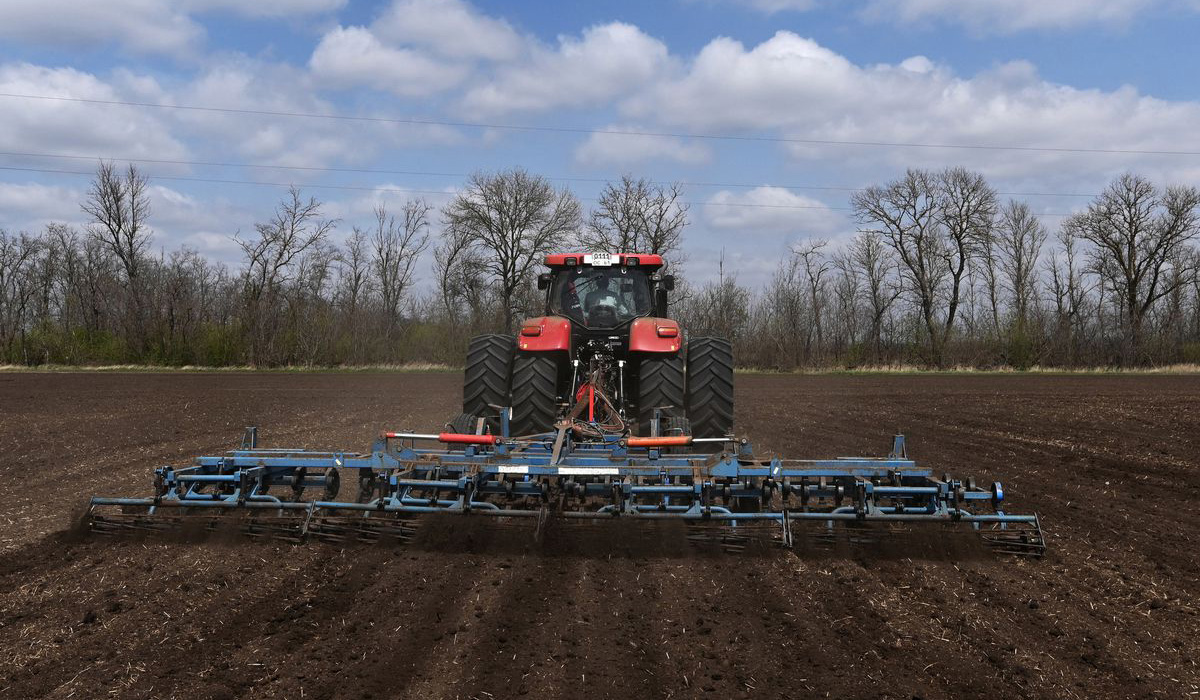A farmer operates a tractor